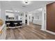Spacious open-concept living space featuring a breakfast bar, decorative columns, and modern flooring at 4401 S Trask St, Tampa, FL 33611