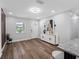 Bright and inviting living space with modern flooring, white walls, and ample natural light at 4401 S Trask St, Tampa, FL 33611