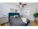 Cozy bedroom with a queen-sized bed, soft rug, and neutral walls at 4711 12Th N St, St Petersburg, FL 33703
