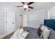 Comfortable bedroom with gray duvet, plush pillows, and a ceiling fan offers relaxation at 4711 12Th N St, St Petersburg, FL 33703