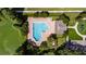 Aerial view of a community pool featuring a unique shape and ample lounge space at 4735 Red Pine Way, Wesley Chapel, FL 33545