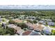 A lush community featuring a pool, a screened in lanai, beautiful homes, and mature trees and manicured lawns at 4735 Red Pine Way, Wesley Chapel, FL 33545