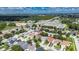 A picturesque neighborhood with manicured lawns, mature trees, and a scenic view of the wetlands in the background at 4735 Red Pine Way, Wesley Chapel, FL 33545