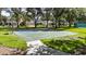 Well-maintained community basketball court with a half-court layout and green and blue surface at 4735 Red Pine Way, Wesley Chapel, FL 33545
