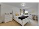 Bedroom with a white bed, matching dressers, and neutral carpet at 4735 Red Pine Way, Wesley Chapel, FL 33545