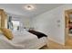 Bedroom with white walls, neutral carpet, and a light-filled window at 4735 Red Pine Way, Wesley Chapel, FL 33545