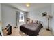 Bedroom with neutral walls, carpet, and floor-to-ceiling curtains at 4735 Red Pine Way, Wesley Chapel, FL 33545