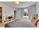 Bedroom with neutral walls, carpet, and a small bookshelf at 4735 Red Pine Way, Wesley Chapel, FL 33545