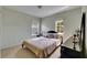 Bedroom with neutral walls, carpeted floor, and bright, sunlit windows at 4735 Red Pine Way, Wesley Chapel, FL 33545