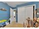 Bedroom features a carpeted floor and closet at 4735 Red Pine Way, Wesley Chapel, FL 33545