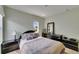 Bedroom with neutral walls, carpeted floor, and a dark wood dresser at 4735 Red Pine Way, Wesley Chapel, FL 33545
