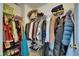 Walk in closet with wire shelving holding clothing and shoes at 4735 Red Pine Way, Wesley Chapel, FL 33545