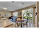Bright dining area with backyard view, features neutral tones and a seamless flow to the adjacent living space at 4735 Red Pine Way, Wesley Chapel, FL 33545