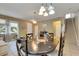Eat-in kitchen featuring a round dining table and stairs at 4735 Red Pine Way, Wesley Chapel, FL 33545