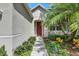 Inviting entrance with colorful landscaping, a walkway leading to the front door at 4735 Red Pine Way, Wesley Chapel, FL 33545