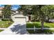 Charming single-Gathering home with a well-maintained lawn and a two-car garage at 4735 Red Pine Way, Wesley Chapel, FL 33545