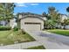 Charming single-Gathering home featuring a well-manicured lawn and attached garage at 4735 Red Pine Way, Wesley Chapel, FL 33545
