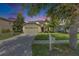 Charming single-Gathering home boasting a well-maintained lawn and mature trees in a peaceful neighborhood at 4735 Red Pine Way, Wesley Chapel, FL 33545