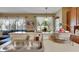 Kitchen featuring a breakfast bar with sink overlooking living area and natural light at 4735 Red Pine Way, Wesley Chapel, FL 33545