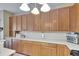 Spacious kitchen featuring ample counter space, and natural wood cabinets at 4735 Red Pine Way, Wesley Chapel, FL 33545