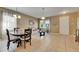 Open-concept living and dining area featuring tile floors and neutral paint at 4735 Red Pine Way, Wesley Chapel, FL 33545
