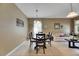 Inviting open-concept living and dining area featuring neutral tones at 4735 Red Pine Way, Wesley Chapel, FL 33545