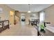 Spacious open-concept floor plan with tiled floors and staircase at 4735 Red Pine Way, Wesley Chapel, FL 33545