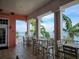 Charming outdoor balcony seating area with stunning waterfront views and lush landscaping at 4985 Cobia Se Dr # A, St Petersburg, FL 33705