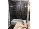 Modern bathroom featuring a tiled shower/tub combination, marble countertop, and stylish fixtures at 4985 Cobia Se Dr # A, St Petersburg, FL 33705