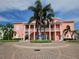 Elegant building entrance with circular driveway, palm trees, and well-manicured landscaping at 4985 Cobia Se Dr # A, St Petersburg, FL 33705
