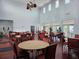 Bright dining area with multiple tables and chairs, perfect for community gatherings at 4985 Cobia Se Dr # A, St Petersburg, FL 33705