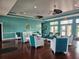 Comfortable lounge area with stylish chairs, wooden floors, and bright, airy ambiance at 4985 Cobia Se Dr # A, St Petersburg, FL 33705