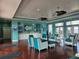 Elegant lounge area with comfortable seating, ceiling fans, and stylish decor at 4985 Cobia Se Dr # A, St Petersburg, FL 33705