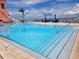 Relaxing outdoor swimming pool with clear blue water and nearby lounge chairs at 4985 Cobia Se Dr # A, St Petersburg, FL 33705