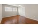 This bright bedroom has a big window for lots of sunlight, laminate flooring, and a closet at 502 Cara Ct # 502, Largo, FL 33771