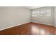This bright bedroom has a big window for lots of sunlight and laminate flooring at 502 Cara Ct # 502, Largo, FL 33771