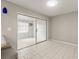 Bright living room with tiled floors and sliding glass doors to another room at 502 Cara Ct # 502, Largo, FL 33771