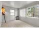 Bright sunroom featuring tile flooring, large windows, and access to the outdoors at 502 Cara Ct # 502, Largo, FL 33771