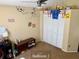 Bright bedroom offering a cozy single bed, study desk, neutral paint, and shelving for organization and decor at 5139 Corvette Dr, Tampa, FL 33624