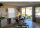 Open-concept dining room has clear slider door access to a large backyard patio at 5139 Corvette Dr, Tampa, FL 33624