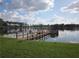 Charming lake community featuring a wooden dock for resident access with scenic water and landscape views at 5139 Corvette Dr, Tampa, FL 33624
