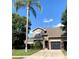Charming two-story home boasts a well-manicured lawn, attached garage, and mature landscaping at 5139 Corvette Dr, Tampa, FL 33624