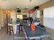 Spacious kitchen & dining with stainless appliances, granite counters, white cabinets and natural lighting at 5139 Corvette Dr, Tampa, FL 33624