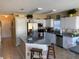 Bright kitchen features stainless steel appliances, granite countertops, and tile flooring at 5139 Corvette Dr, Tampa, FL 33624