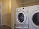Convenient laundry area featuring a modern washer and dryer set, efficient for household chores at 5139 Corvette Dr, Tampa, FL 33624