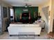 Comfortable living room with white sofa, contemporary decor and a ceiling fan at 5139 Corvette Dr, Tampa, FL 33624