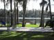 Lakefront community playground offers a fun slide, swing set, and dock access with scenic water views at 5139 Corvette Dr, Tampa, FL 33624