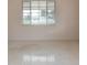 Bright bedroom featuring neutral walls, carpet flooring, and a large window letting in natural light at 5221 48Th N Ave, St Petersburg, FL 33709