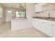 Bright, open kitchen space with a breakfast bar, perfect for casual dining and entertaining at 5221 48Th N Ave, St Petersburg, FL 33709