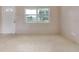 Inviting living room with large windows and neutral walls for versatile decor options at 5221 48Th N Ave, St Petersburg, FL 33709
